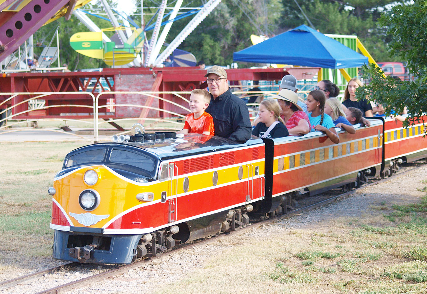 Robbie Berning conducts the fan-favorite train with some assistance from a young conductor-in-training.