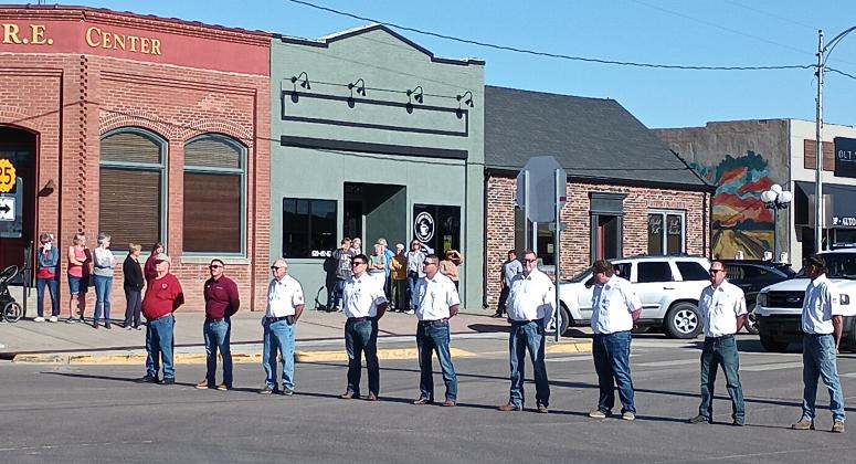 Top Right: Leoti First Responders and citizens gathered to pay tribute as the memorial procession went through town.