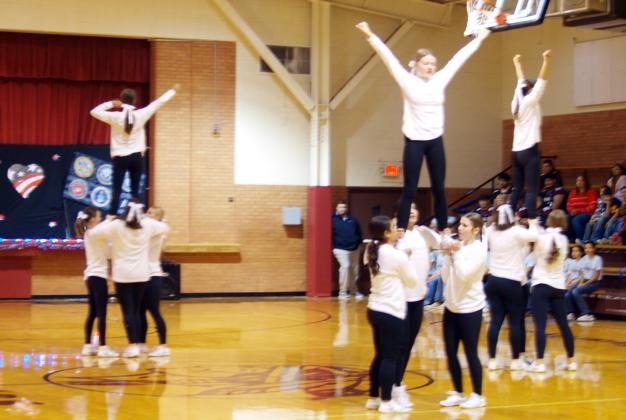 The Cheerleading squad performed at the Veterans Program.