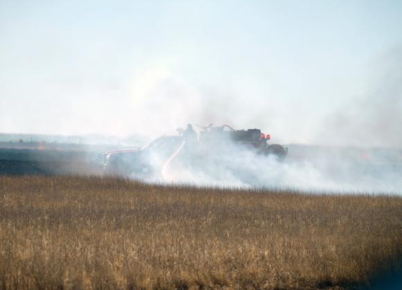 Dried brush, weeds, and stubble make great fuel for a quick-moving fire, as Lydia residents and commuters were reminded Wednesday last week. A passing semi-truck was the cause of the excitement, as the sparks and errant flames from a blown tire ignited roadside kindling.