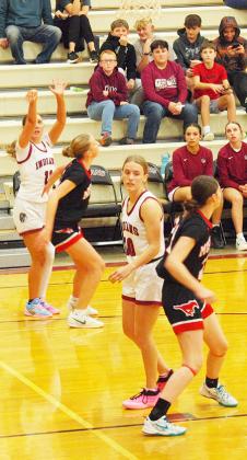Audrina Marcy, 11, takes a shot.