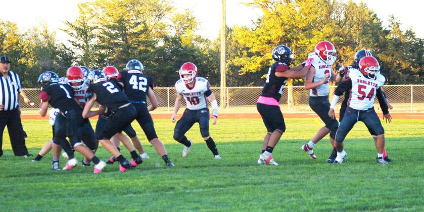 Huck Carpenter (2) forces the ball through the D-Line of the Sublette Larks with help from Tyson Peters (1) and Chase Carpenter (42)