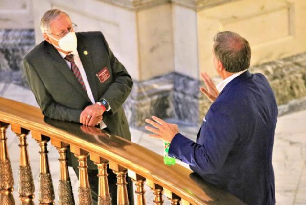 State Rep. Richard Prohel, a Republican from Parsons, listens to lobbyist John Federico. Photo Credit: Jim McLean