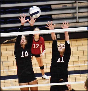 McKenzie Porter and Giselle Alcaraz go up for the block while Kaylee Wilbur covers. Photo by Misty Gardner.