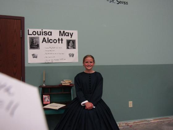 Emery Bauck as Louisa May Alcott