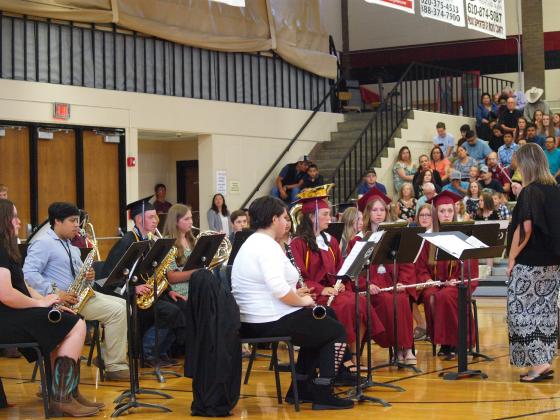 The band with seniors playing at graduation for the last time