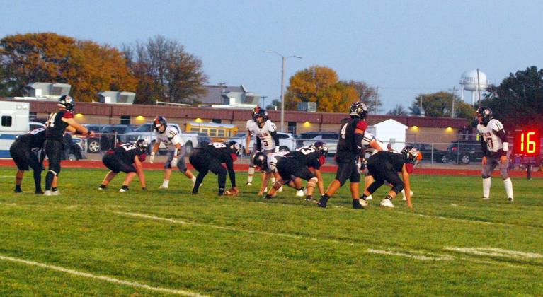 Cashton Young (14) waits for the snap of the ball in the game against the Ellis Railroaders.
