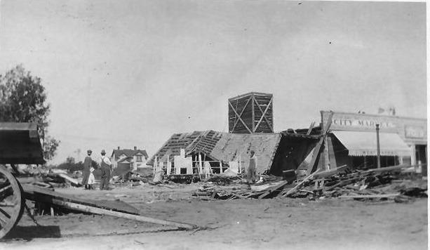 Above: A look across 4th Street to what's left of the City Market and its flattened neighbors. No word on the what the surviving tall structure was. The Washington House can be spied mostly undamaged in the background.