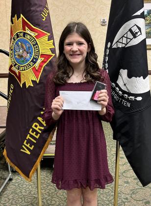Emerson Biermann poses with her prize envelope at the state VFW convention. Biermann placed 2nd at state with her Patriot's Pen essay. Photo courtesy Tara Biermann