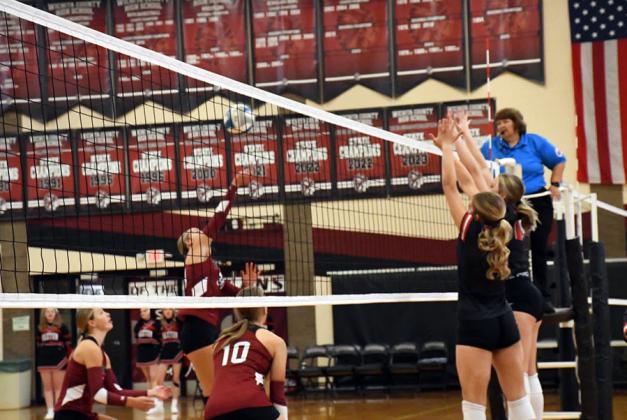 Senior attack trio for the Indians. Marcy Baker goes up for the kill while Breanne Ricke and Kenzie Porter cover. Photo by Misty Gardner