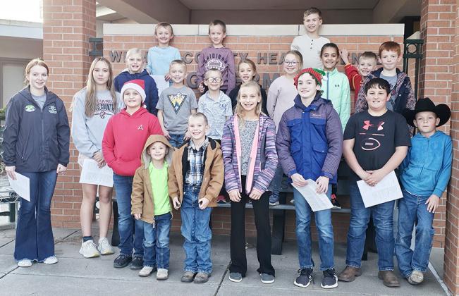 Members of the Lydia Jayhawkers 4-H Club singing at the Wichita County Long Term Care Center.
