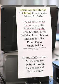 A sign telling customers what items are on sale as the store closes. Calen Moore/Kansas News Service
