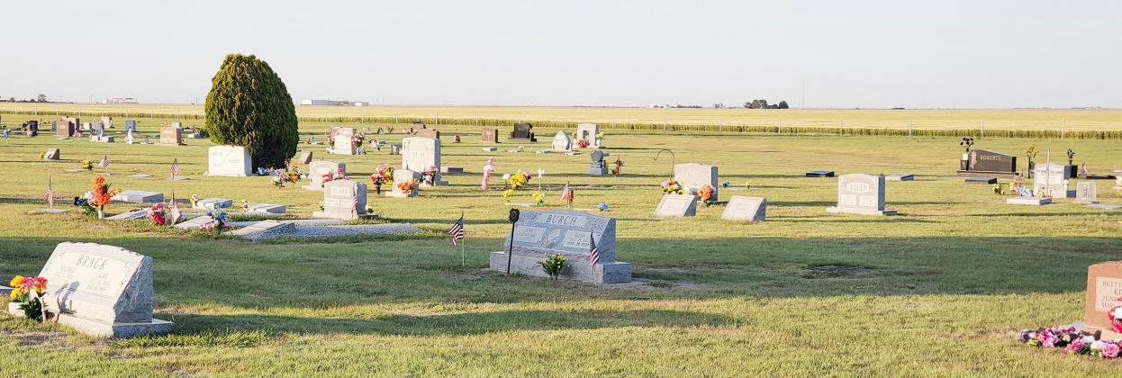 Left: These p h o to s s h ow just a few of the many graves that were beautifully d e c or a ted i n memor y an d appreciation of the sacr i f i c e s made by the very many veterans buried in the Leoti Cemetery. Many civilians were also remembered with flowers and visits from those who remain behind.