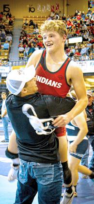 Above: Beau Porter hugged by his dad, Brent. Beau earned 6th .