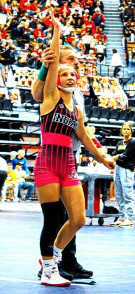 Above: Jentri Porter's arm lifted in victory. She placed 3rd in the 105 weight class.