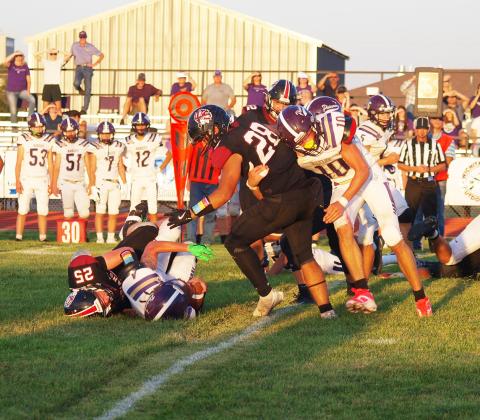 Holden Whalen (25) takes down the Oakley quarterback.