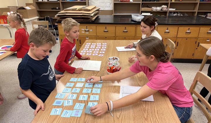 Garrix Burch and Collin Berning play 'Sugar and Statistics' with Tessa Bauck and MacKenzie Vestal. (Remi Fletcher can be seen in the background.)