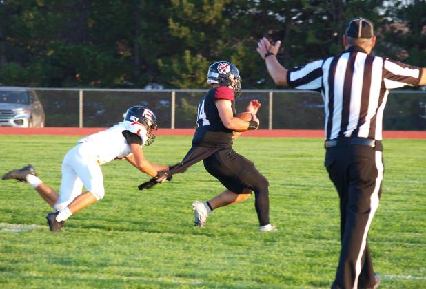 In this sequence, Cashton Young (14) is confronted by an Elkhart very determined Elkhart defender just outside the end zone. Unsurprisingly, Young picked up the 6. But did the shirt make it? Inquiring minds and all that.