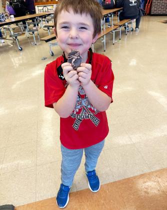 Birthday boy Brodie Wishon celebrates his 3rd place medal.