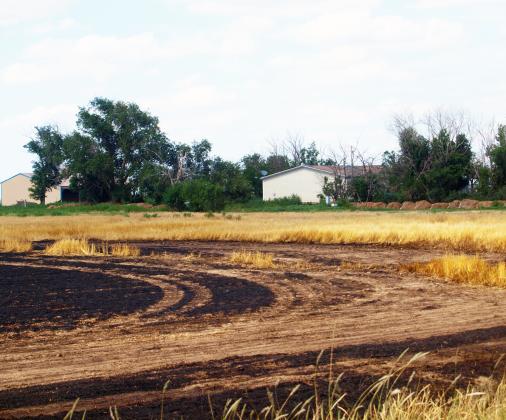Leoti Volunteer Fire Department Battles Wheat Field Fire in South of County