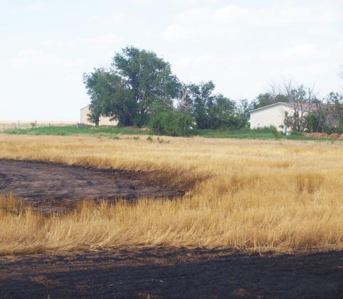 The fire got uncomfortably close to the home and out-buildings.