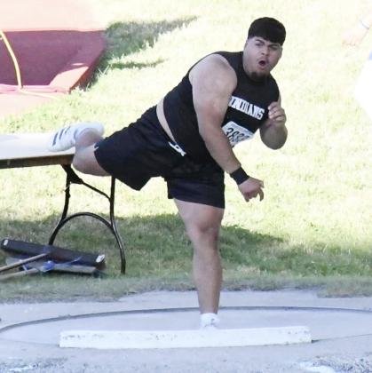 Simon Medina throws the shot put. He would throw a season-best and secure third place. Inset: Simon celebrates with Coach Allen Baker after a throw.