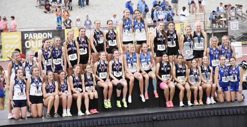 Women's 4x400 Team on the Medals Podium, posing with their Bronze medals