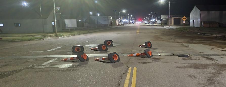 Traffic cones on 4th Street (Hwy 25) were knocked over during Saturday's storm. Reminds your editor of the 'We Shall Rebuild' patio furniture meme.