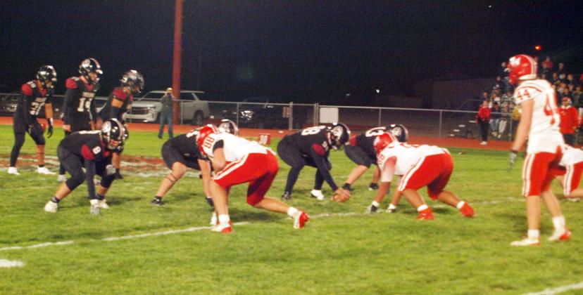 Above, the Wichita County Indians, in home black, prepare to put the ball in motion during the Sectionals playoff game at home versus the Hoxie Indians.