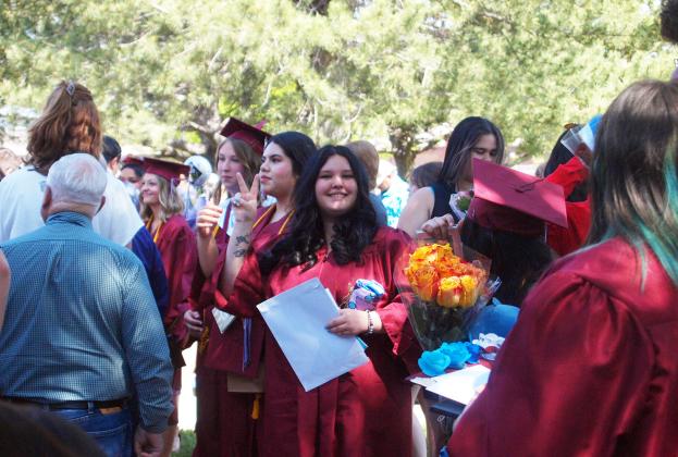 After the ceremonies, Graduates gather outside to receive well-wishers.