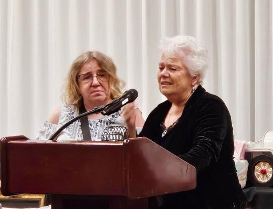 An emotional Kelma Burch accepts her Outstanding Member of the Year award at the Kansas Rural Letter Carriers' Association convention in Wichita.
