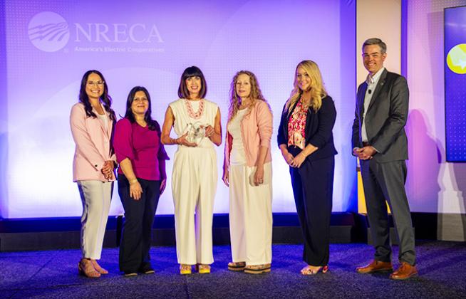Wheatland Electric Cooperative, Inc. is presented with the Edgar F. Chesnutt Award at NRECA’s 2026 Connect Conference in San Diego, Calif. Pictured (from left) is the Member Services team: Samantha Garcia, Shajia Donecker, Alli Conine, Mary Hoisington, Caitlin Moser. Also pictured is Stephen Bell (far right), NRECA’s senior vice president of communications. (Photo: Jerry Mosemak/NRECA)