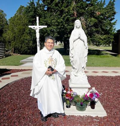 The cemetery's previous crucifix, now restored, has found a new home in the rosary garden.