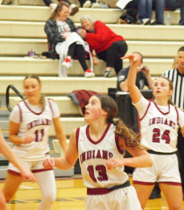 Above: Emerson Biermann (3) enters the offensive zone. Below: Audrina Marcy (11) and Jayah Case (13) watch Marcy Baker’s (24) shot.