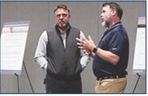A Triple Oak Power employee explains to locals the timeline of the project and answers questions. Calen Moore/Kansas News Service