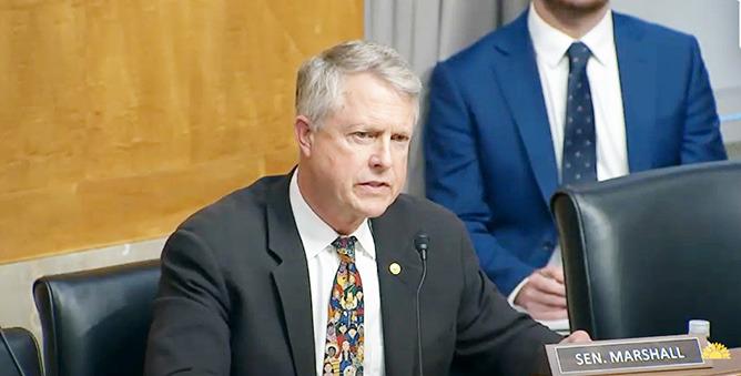 U.S. Sen. Roger Marshall, R-Kansas, delivered a series of questions to the U.S. postmaster general about delivery problems, stamp costs and other management issues hindering Postal Service performance. (Kansas Reflector screen capture of U.S. Senate’s YouTube channel)