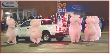 Seaboard Foods' piggies stage a daring escape right in the middle of the 4-Way! Welcome to the Lighted Parade segment of the Christmas in Leoti celebration.