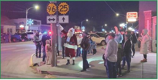With a flick of his wrist and a hometown cheer, Santa powers on the City's Christmas Lights!
