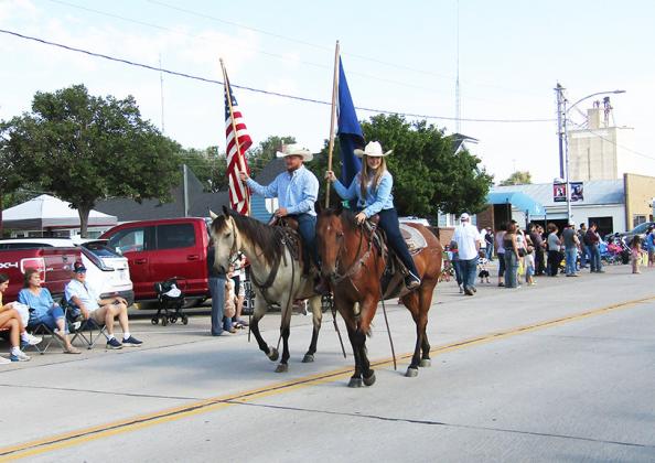 Flag-bearers Colton and Lauren Sheppard kick off the festivities.