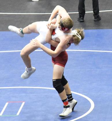 Left: Angela Barreras imposes her will. Above: Jaelene Vestal wrestles hard. Right: Beau Porter shows his strength.