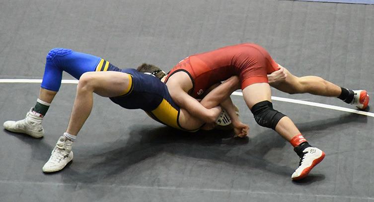 Above Left : Angela Barreras placed 6th at State. Above Center: Tyson Peters placed 4th. Above Right: Beau Porter placed 3rd. Right : Tyson Peter s wrestling to his 4th place finish. Left: Gavvan Castillo in action.