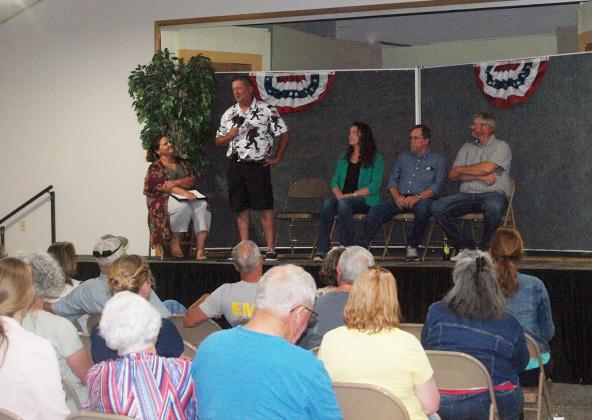 Despite the sweltering heat inside and outside, the audience of interested voters and fellow candidates, paid rapt attention as the candidates for local office answered questions put to them by event moderator, Christy Hopkins, editor and publisher of The Greeley County Republican.