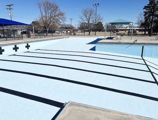 Above: Gorgeous, bright, and water-tight. The new pool liner is in place, with racing stripes, er, lines adding that perfect sporty touch. Below: Another look at the improvements done at the community swimming pool. In addition to replacing the liner, crews repaired and replaced ladder bumpers, and put down new lane lines.
