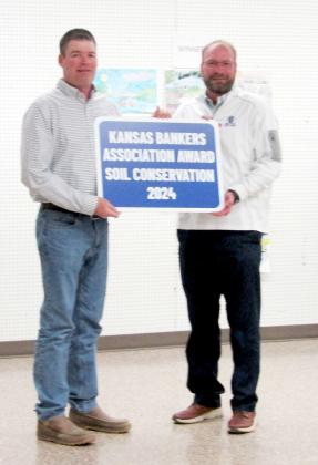 Western State Bank's Brady Harbin (R) presents the Kansas Bankers Association 2024 Soil Conservation Award to Joe and Tara Biermann. Unfortunately Tara was unable to be present.