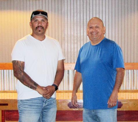 Above: Pete Luna, the owner of the new Salty Pete's poses with bartender Hector Heredia. Left: The interior of the longtime landmark boasts, among other things, new lighting, refreshed paint, and more televisions.