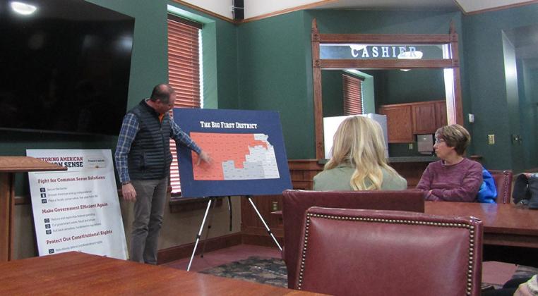 Kansas Big First District Congressman Tracey Mann points out a location within the district on a map during his visit to Leoti last week.