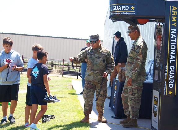 The Kansas Army National Guard are on hand with information, entertainment (a boxing machine), and community support.