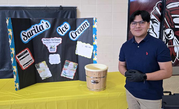 Tiffanie Ponce presents her wonderful nail design business. Angel Romero stands with his delicious ice cream venture.