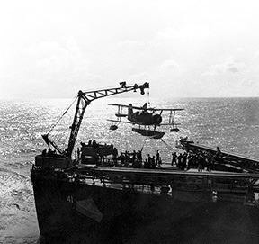 Scout plane being hoisted onto the ship