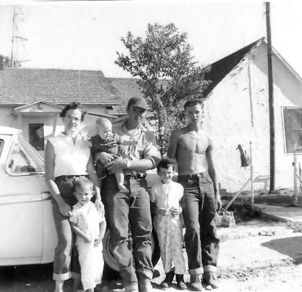 The Wiegers family in 1961. Lorna keeping Mike still, Dean holding Russ, Deana ready to get back to playing, and Dean’s brother Dave, cooling off. photo provided